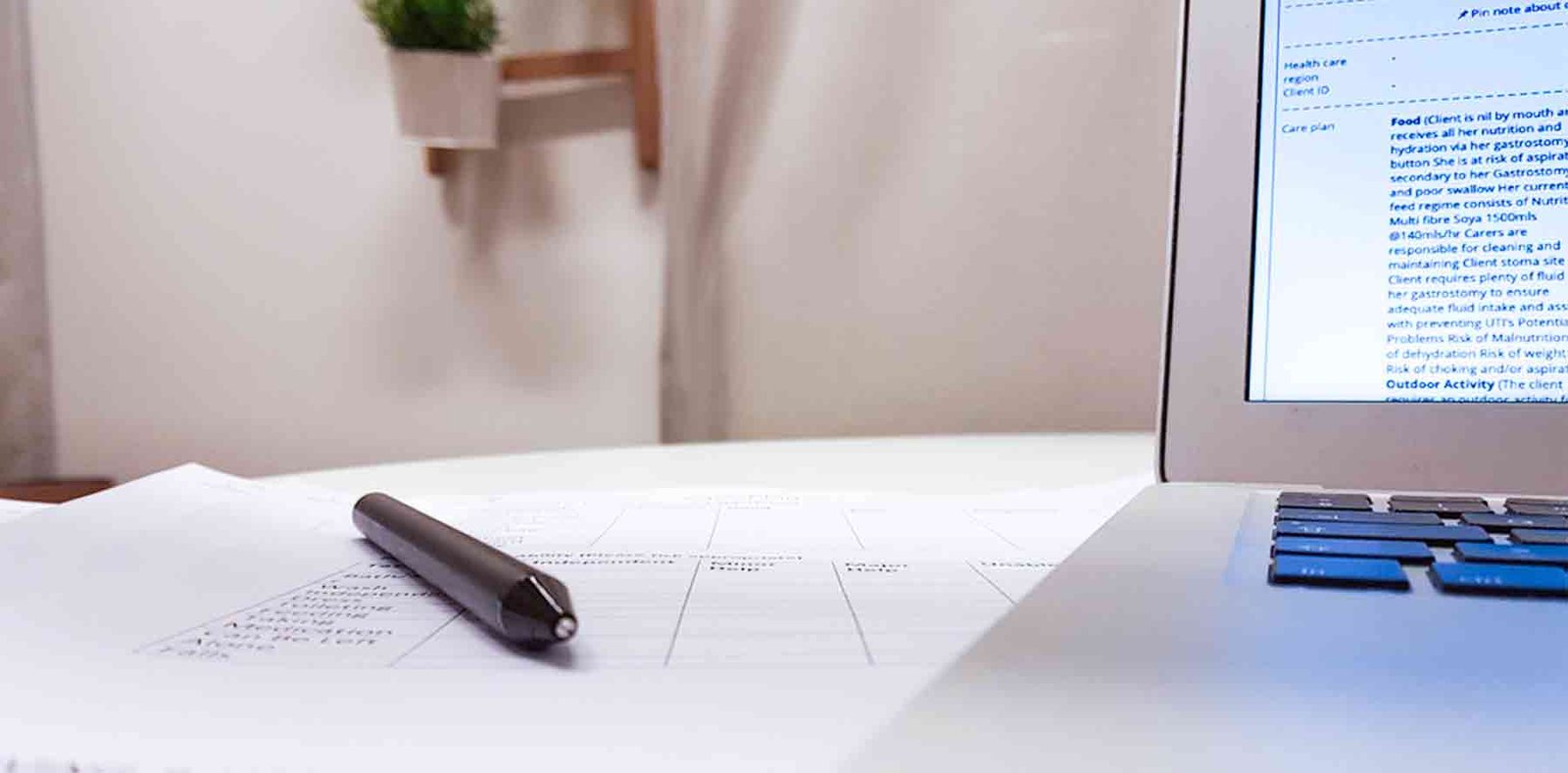 Close-up of a pen lying on top of a printed rota
