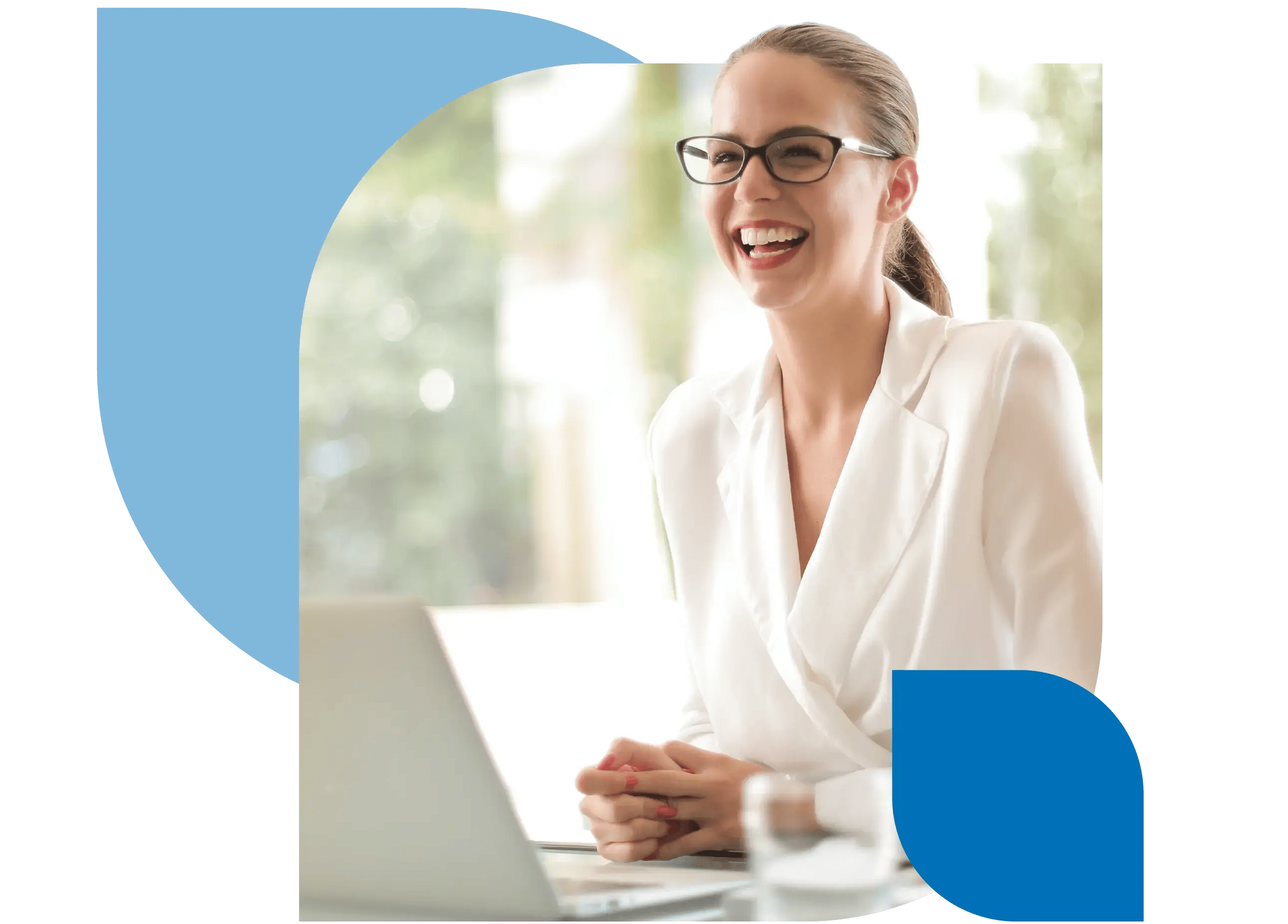 A care manager laughs while sitting in front of a laptop