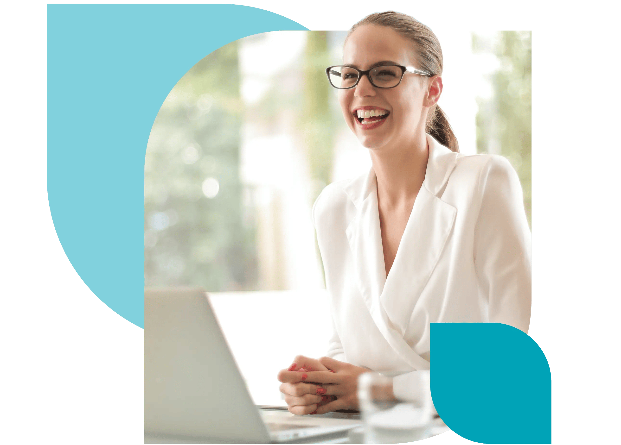 A happy care manager, smiling while sitting in front of a laptop