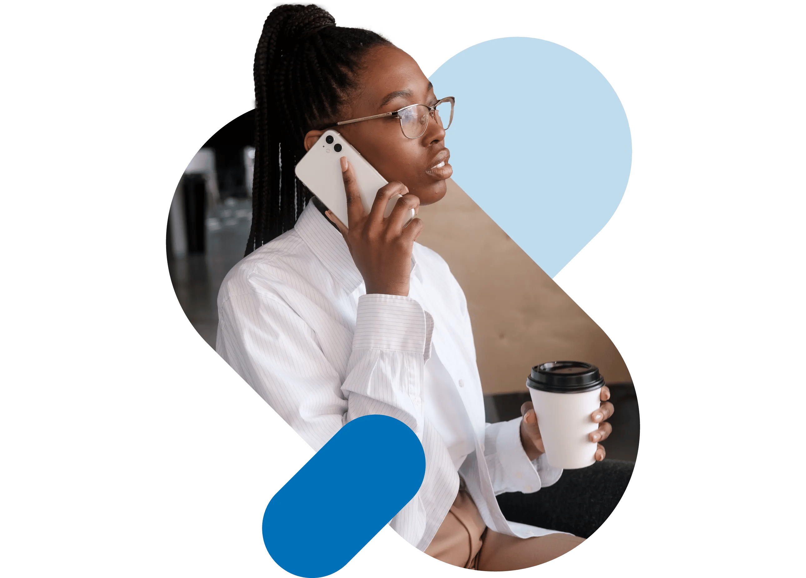 A care manager talking on her mobile while holding her coffee