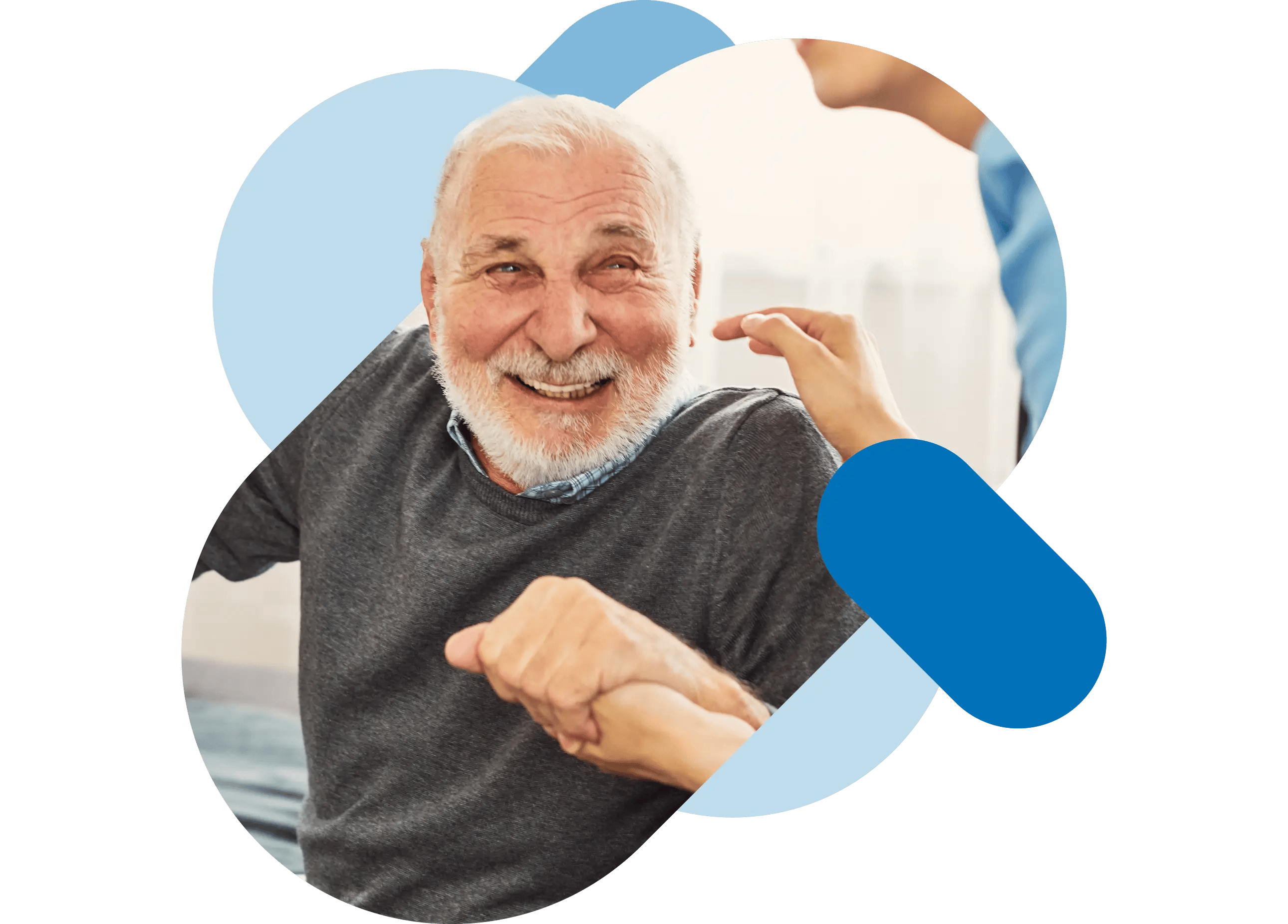 A smiling elderly gentleman in a grey jumper