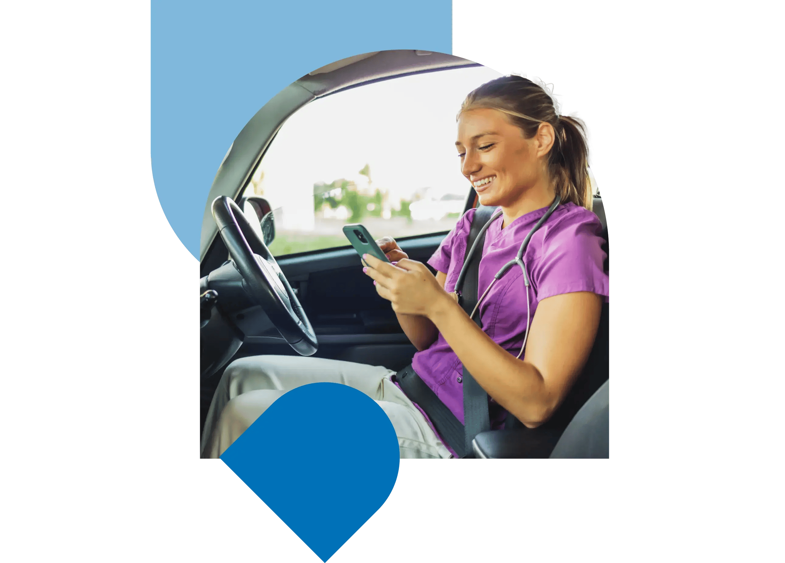 A smiling care worker sitting in their car using a mobile phone